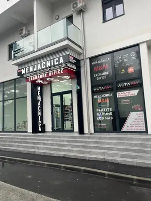 a store front with stairs in front of a building at R Lux Apartman Jagodina Akva Park in Jagodina