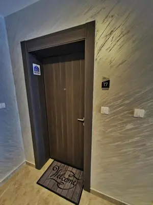 a door in a room with a sign on the wall at Apartman Damjan Sokobanja in Soko Banja
