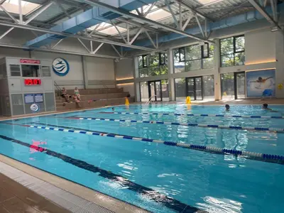 a large swimming pool with many people in it at luxury Pool Apartment Jagodina in Jagodina