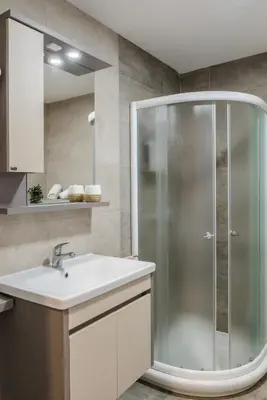 a bathroom with a shower and a sink at SPA 25 in Vrnjačka Banja
