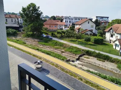 a view of a street from a balcony at SPA 25 in Vrnjačka Banja