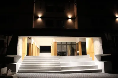a group of stairs in front of a building at night at Apartman Mist - Bela Reka Kopaonik in Brzeće