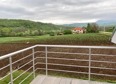 a view of a farm from the porch of a house at Agro Lux Apartment - Milenović in Soko Banja