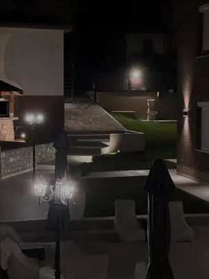 a night view of a patio with lights at GOLDEN VIEW Sokobanja in Soko Banja