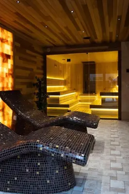 a lobby with two benches and a room with a building at GOLDEN VIEW Sokobanja in Soko Banja