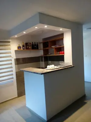 a kitchen with a blue counter in a room at STD Cvetković in Crni Vrh