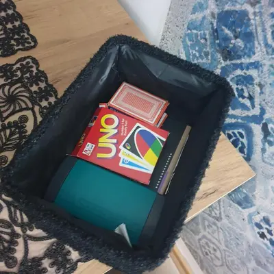 a cake shaped like a book and a box with books at Apartman Dunjic in Vrnjačka Banja
