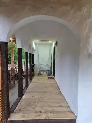 a walkway leading to the porch of a house at Kmetova Bajka in Janja