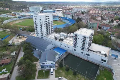 an overhead view of a building with a tennis court at Cozy and Lovely Apartments I & II in Jagodina