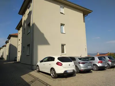 a group of cars parked next to a building at Apartment Vojinović in Soko Banja