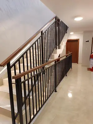 a hallway with a staircase in a building at Mirabela Apartman Sokobanja in Soko Banja