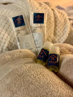 two bottles of beer sitting on a blanket at Villa Prive and Spa in Kopaonik
