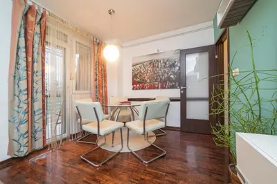 a dining room with a table and two chairs at Nana in Pirot