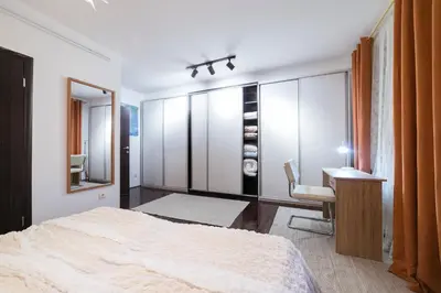 a bedroom with a bed and a desk and a chair at Nana in Pirot