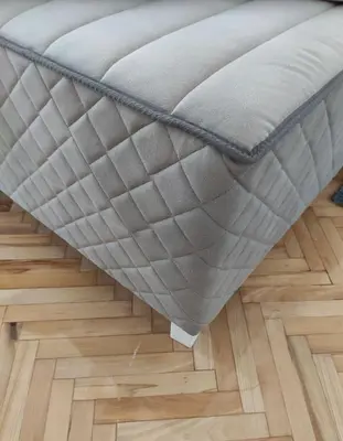 a ottoman in a room with a wooden floor at Park 1 MARKO FREE PARKING in Vranje