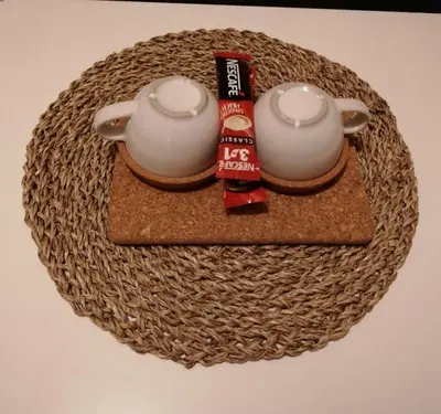 a table with two tea pots on a wicker tray at Park 1 MARKO FREE PARKING in Vranje