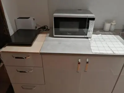 a microwave sitting on a counter in a kitchen at Park 1 MARKO FREE PARKING in Vranje