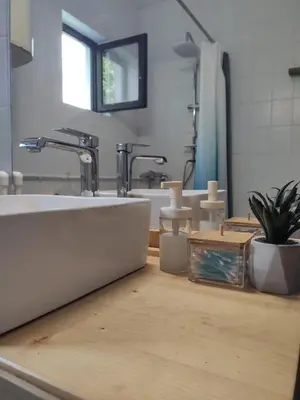 a bathroom with a sink and a counter top at Park 1 MARKO FREE PARKING in Vranje