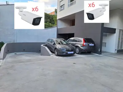 two cars parked in a parking lot next to a building at Lux apartment 8, center, free parking in Niš