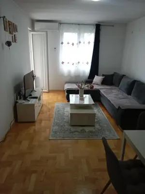 a living room with a couch and a table at Apartman Vera in Vrnjačka Banja