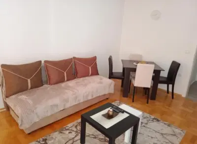 a living room with a couch and a table at Apartman Vera in Vrnjačka Banja
