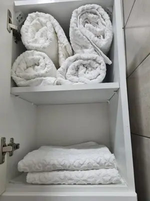 a closet filled with lots of towels at Apartment Esperanto next to the Aqua Park in Jagodina
