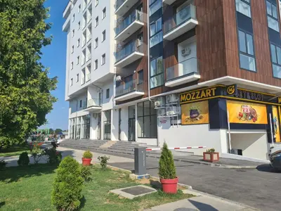an apartment building with a sign for a restaurant at Apartment Esperanto next to the Aqua Park in Jagodina
