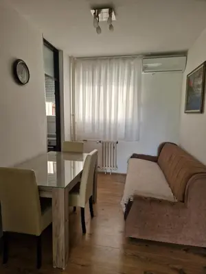 a living room with a couch and a glass table at Esperanto in Vranje