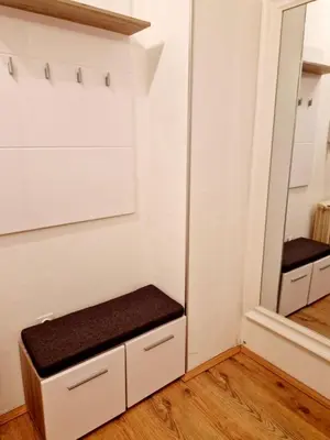 a dressing room with a bench and a mirror at Esperanto in Vranje