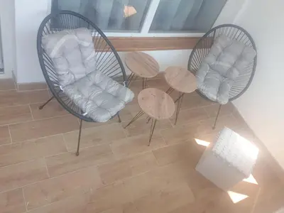 two chairs and a table in a room at SANI in Vrnjci
