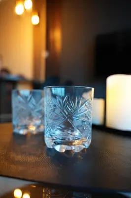 two glasses of water sitting on a table at Diamond Apartments Niš in Niš