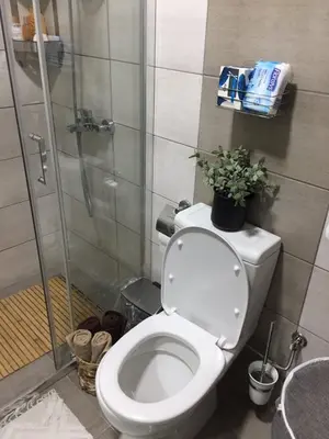 a bathroom with a toilet and a glass shower at Apartman Mijatovic in Jagodina