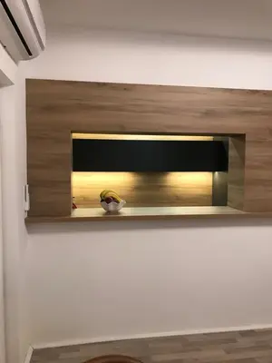 a shelf on a wall with a bowl on it at Race for Space in Niš
