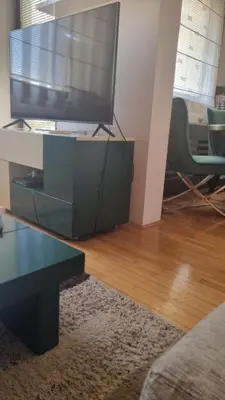 a living room with a television on a table at Aleksandar in Pirot