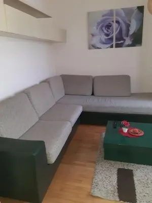 a living room with a couch and a table at Aleksandar in Pirot