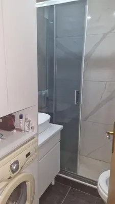 a bathroom with a shower and a toilet and a sink at Aleksandar in Pirot