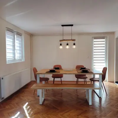 a dining room with a table and chairs at Sienas Holiday Home in Vrnjačka Banja