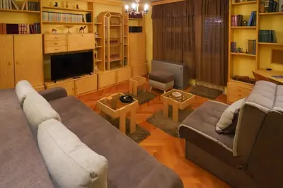 a living room with a couch and a tv at City center in Zaječar