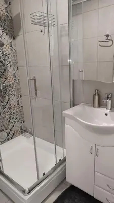 a bathroom with a shower and a sink at Royal Vila Bozovic - G5 i G6 in Vrnjačka Banja