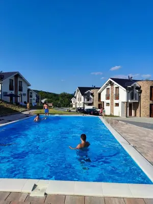 a group of people in a swimming pool at Royal Vila Bozovic - G5 i G6 in Vrnjačka Banja