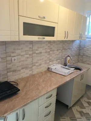 a kitchen counter with a sink and a microwave at Vila Kruna in Soko Banja