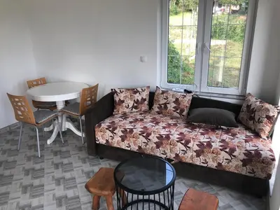 a living room with a couch and a table at Vila Kruna in Soko Banja