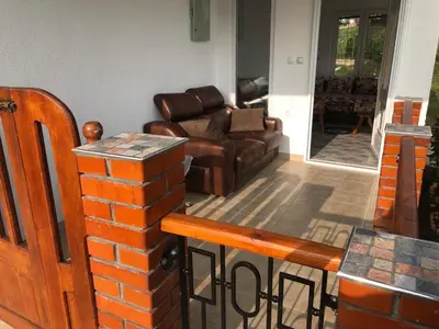 a living room with a couch and a table at Vila Kruna in Soko Banja