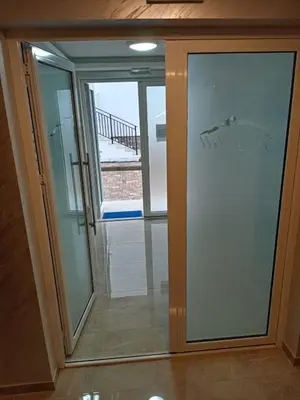 a sliding glass door with a view of a balcony at Apartman Pan in Soko Banja