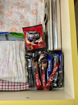 a drawer filled with chips and snacks in a refrigerator at Idila pod Rtnjem - Najam cele vikendice sa bazenom in Ilino
