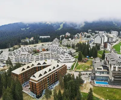 an aerial view of a large city with buildings at Woodside Apartment in Kopaonik