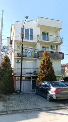 a car parked in front of a building at DREAMER apartment in Vrnjačka Banja