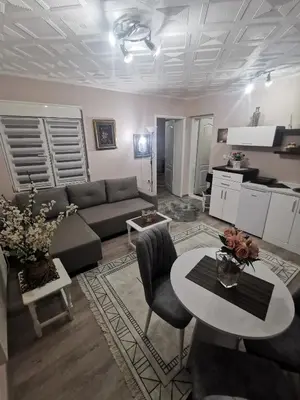 a living room with a couch and a table at DJERDAN in Vranje