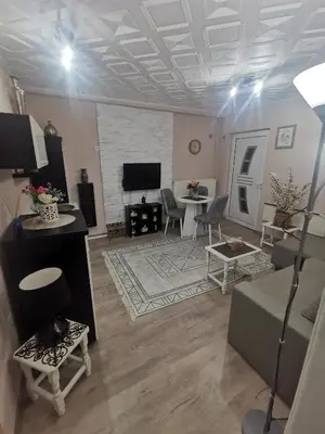a living room with a couch and a table at DJERDAN in Vranje