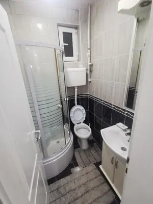 a bathroom with a toilet and a shower and a sink at DJERDAN in Vranje